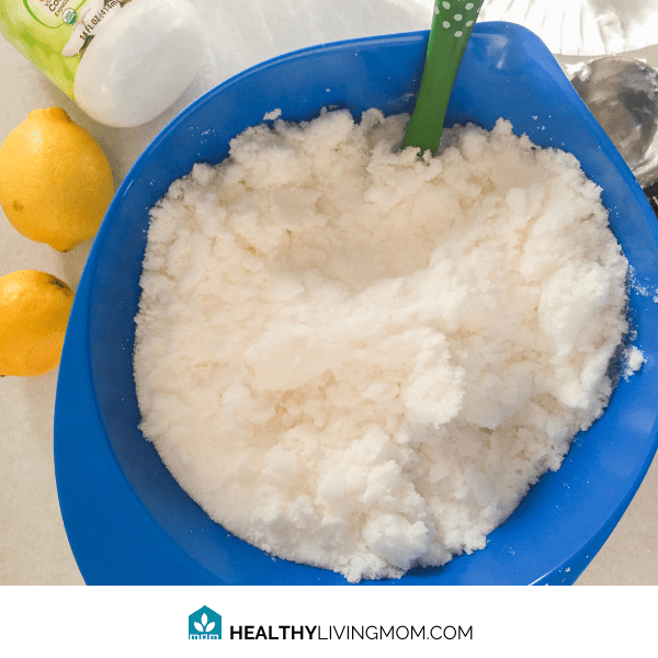Lemon Sugar Scrub - Mixing together the sugar, coconut oil, and lemon.
