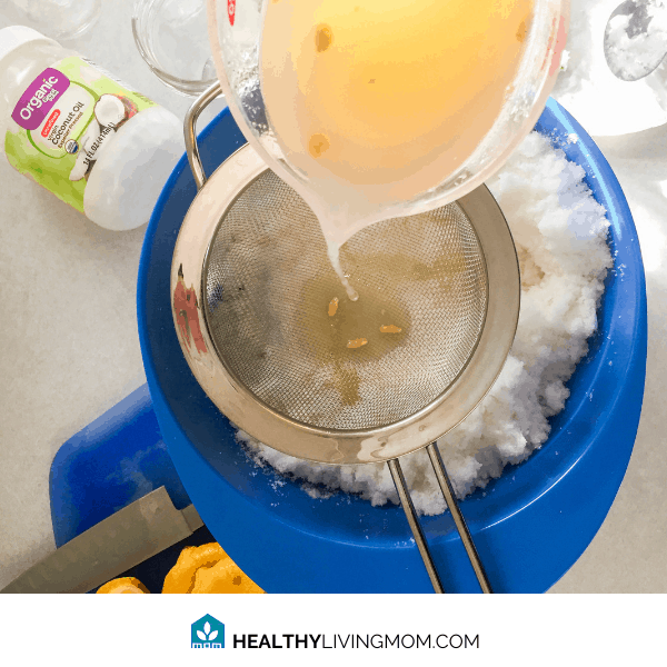 Lemon Sugar Scrub - Step 3 - pour that lemon juice through the strainer into your mixing bowl.