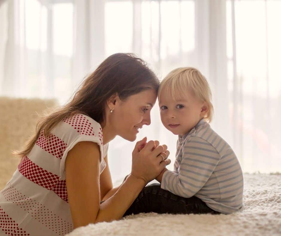 Christian mom teaching son to pray