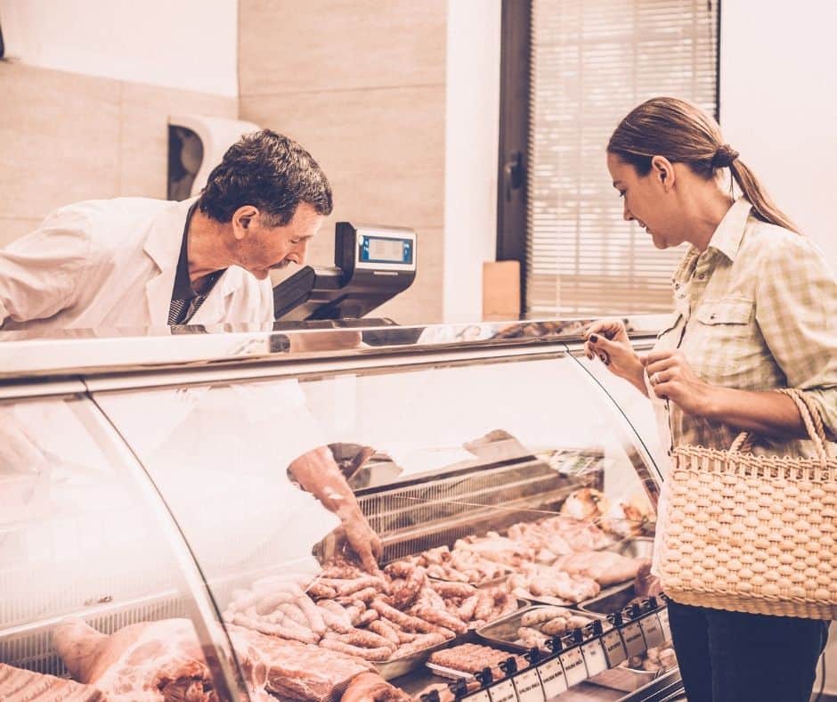 picking out meat at the butcher