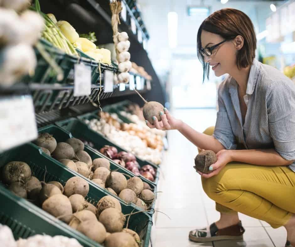 woman picking fresh beets