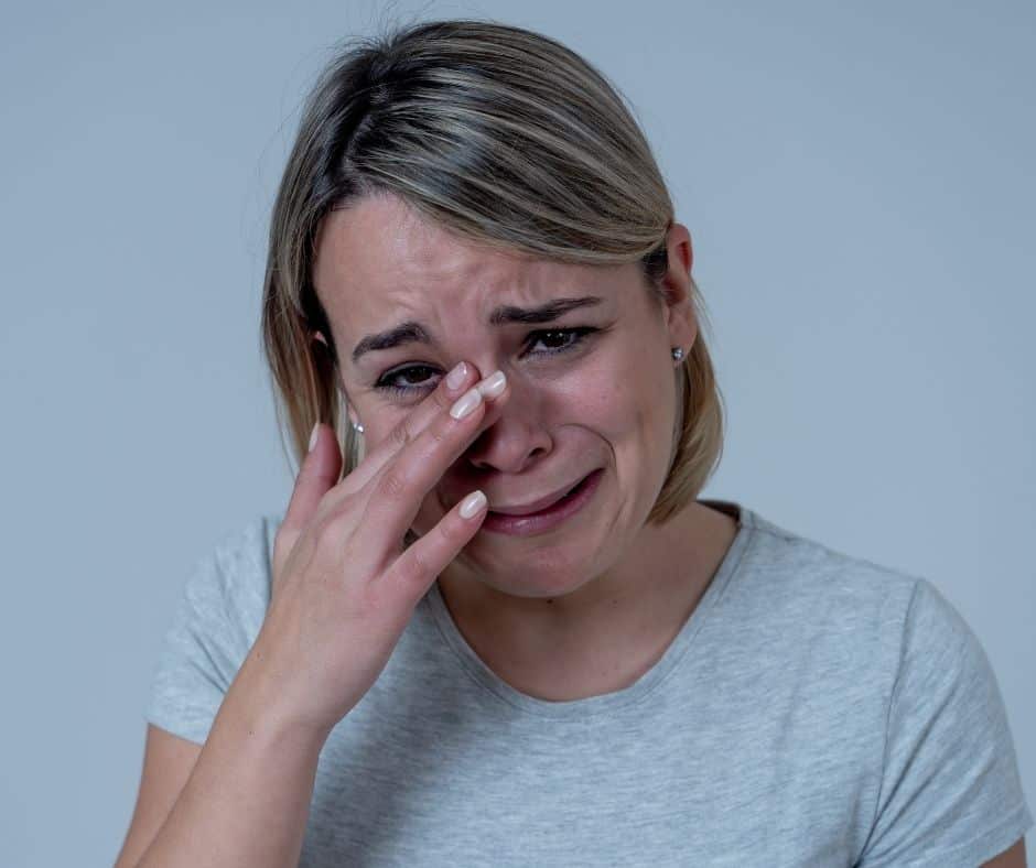 young woman crying mentally emotionally exhausted